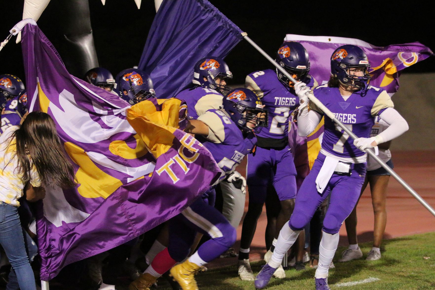 Tigers stay hot with 42-6 rout of Pioneers, clinch playoff spot